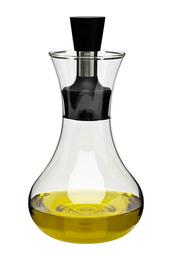 Glass decanter containing olive oil Photograph by Creative Crop