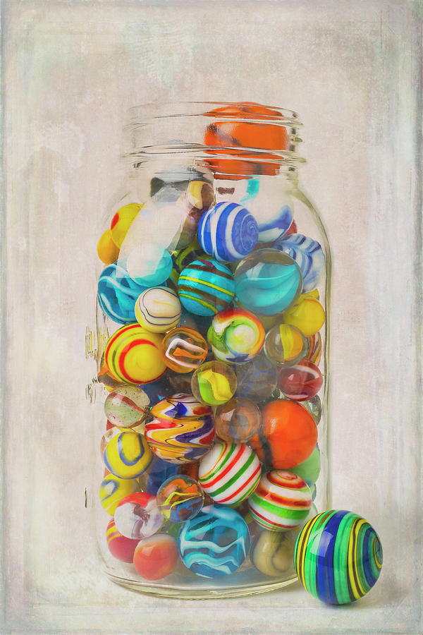 Glass Jar Of Colorful Marbles Photograph by Garry Gay