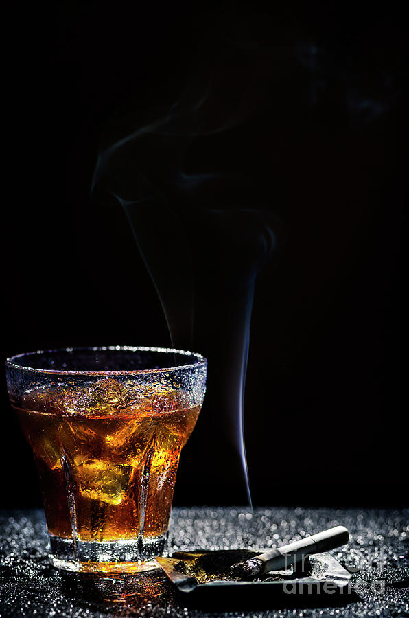 Glass of cold drink and tobacco Photograph by Jelena Jovanovic
