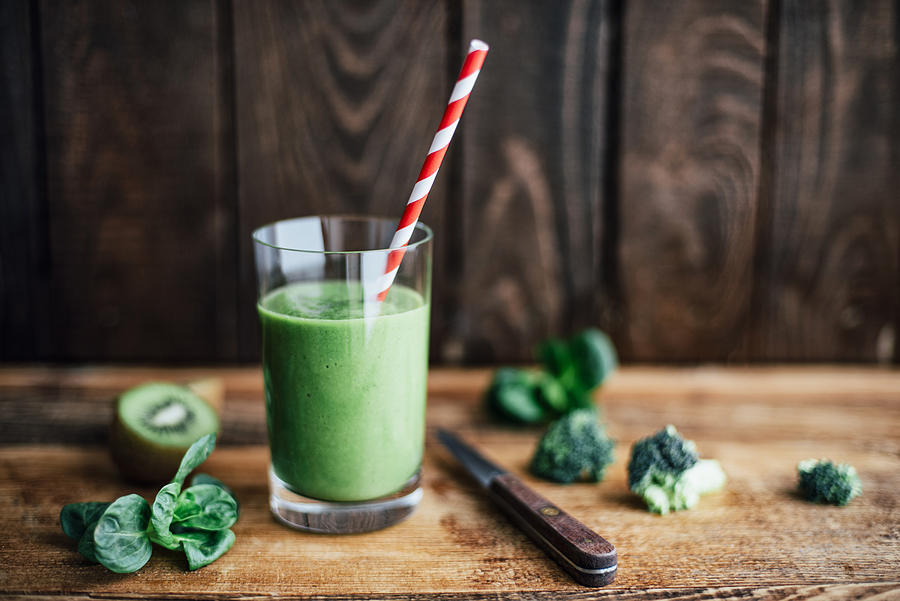Glass of green smoothie Photograph by Westend61