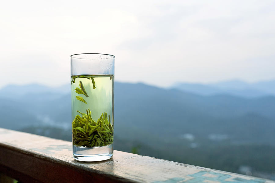 Glass of green tea,Hangzhou,China Photograph by Xia Yuan