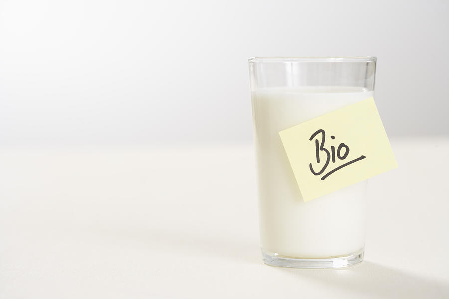 Glass of milk with a note on it Photograph by Stock4b-rf