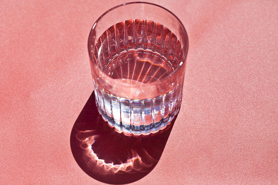Glass of water Photograph by Jenny Dettrick