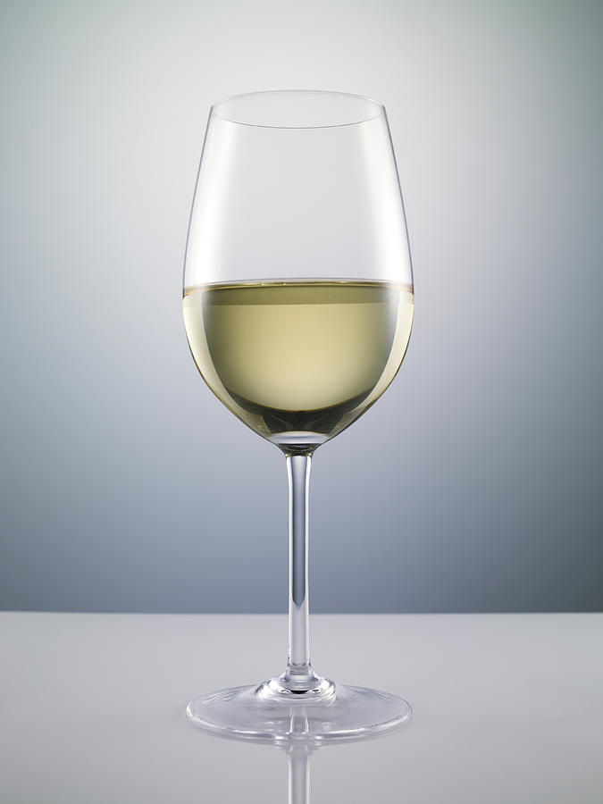 Glass of white wine Photograph by Yamada Taro