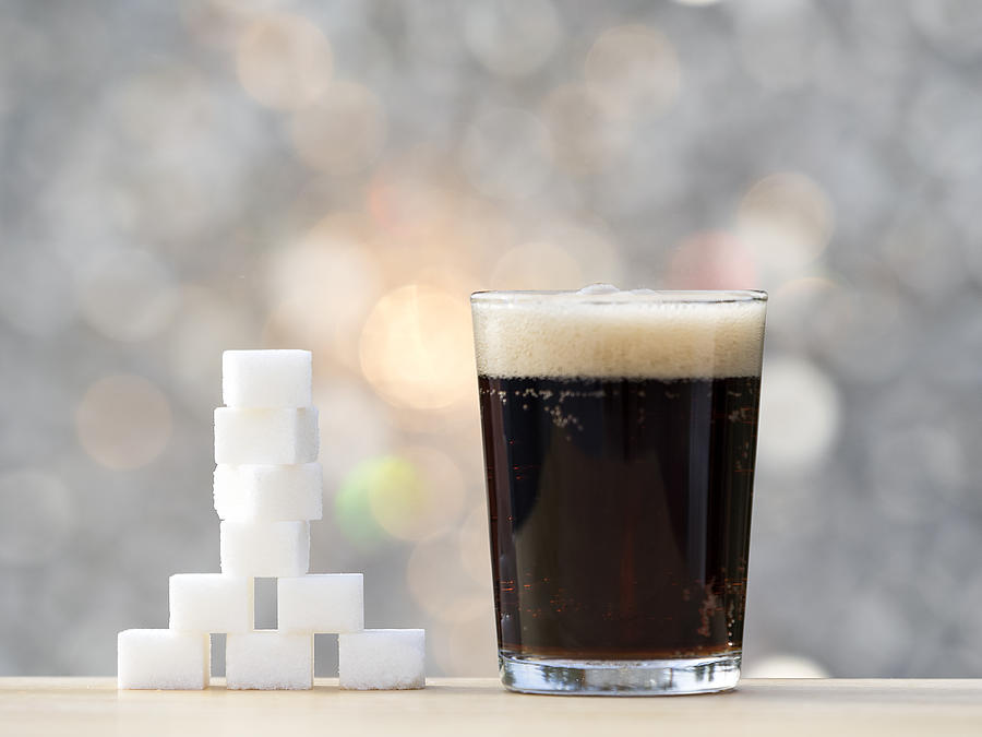 Glass with cola and its equivalent in sugar cubes Photograph by Jose A. Bernat Bacete