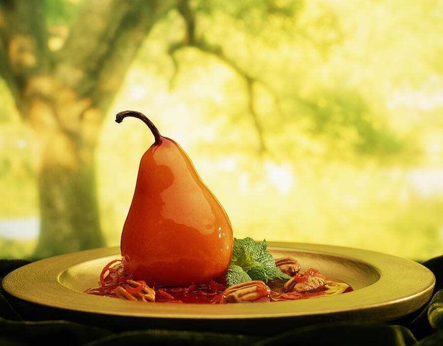 Glazed Pear On Gold Plate With Tree In Background Photograph by Will Crocker