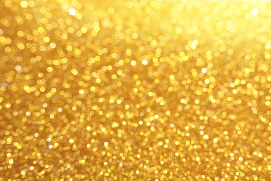 Glitter in gold coloration Photograph by Enter89