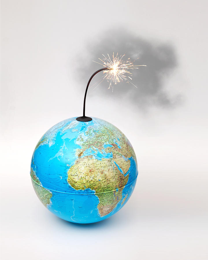 Globe bomb with smokey lit fuse on white background Photograph by F_