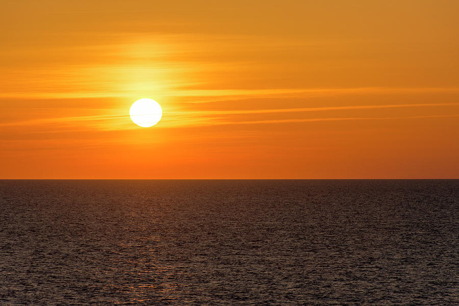 Glowing Orange Sunset On The Ocean Photograph by Debra Martz
