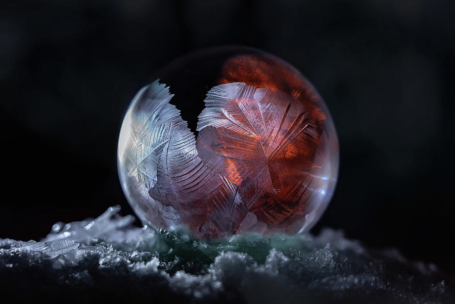 Glowing red frozen bubble Photograph by Jaroslaw Blaminsky