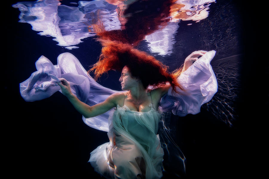 Goddess floating in the water Photograph by Dan Friend