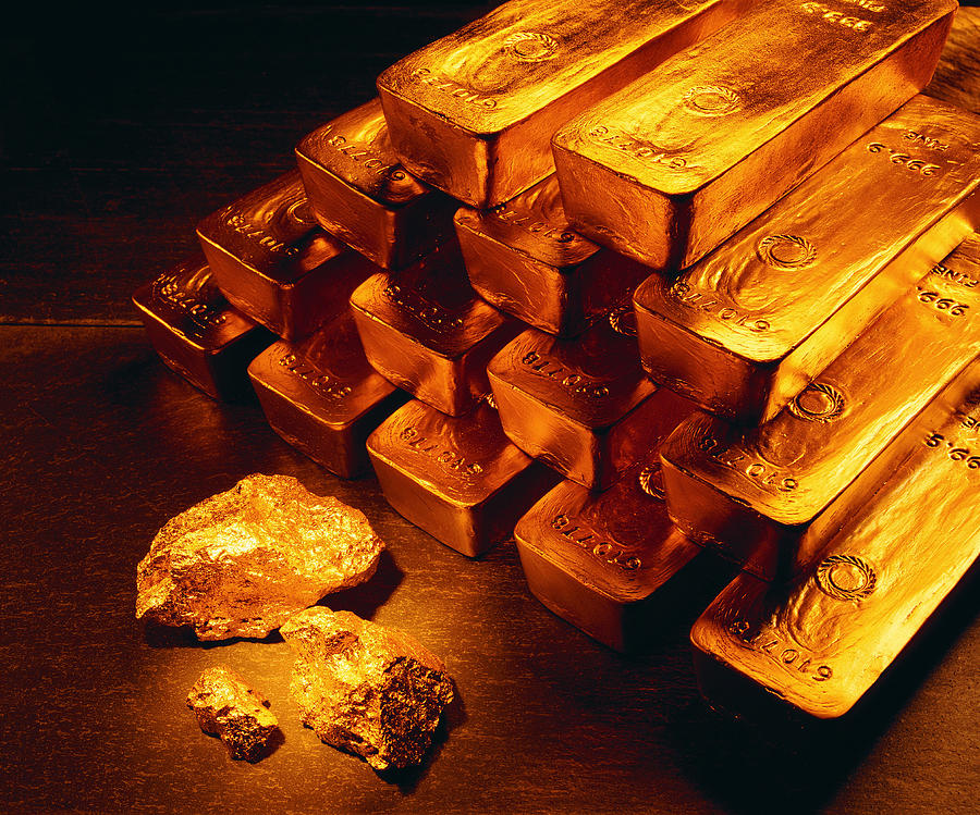Gold bars, coins and raw nuggets Photograph by Stockbyte