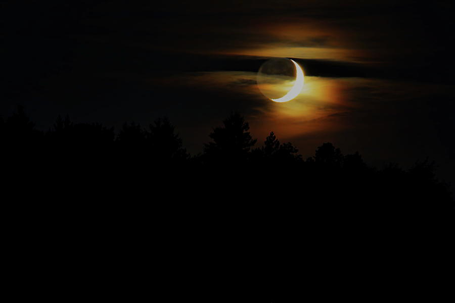 Golden Earthshine Crescent Moon And Wispy Clouds Photograph by Dale Kauzlaric