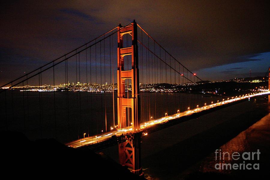 Golden Gate at night Photograph by Ed Stokes