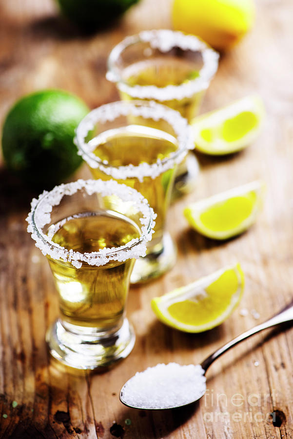 Golden Mexican Tequila In Shot Glasses Photograph