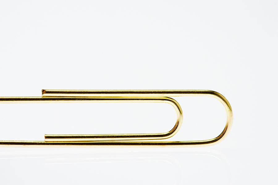 Golden paperclip Photograph by Image Source