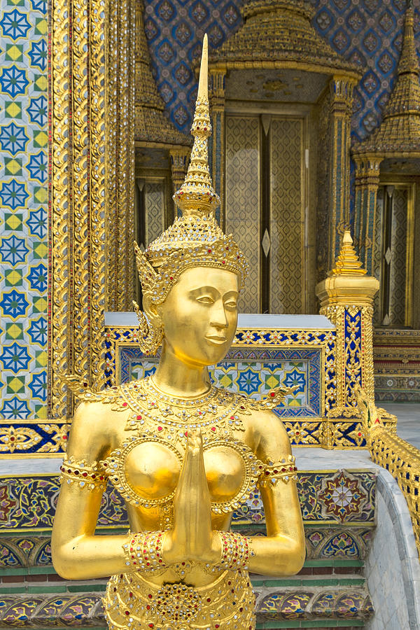Golden statue outside ornate temple, Bangkok, Thailand Photograph by John D. Buffington