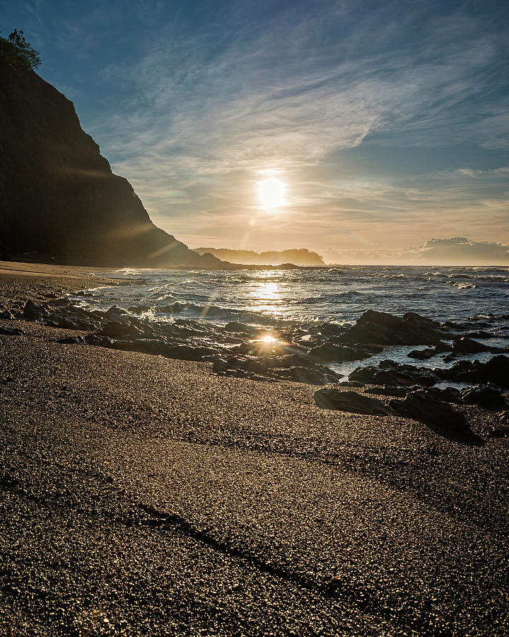 Golden sunlight reflection on sand beach at Punta Samara Photograph by Henri Leduc