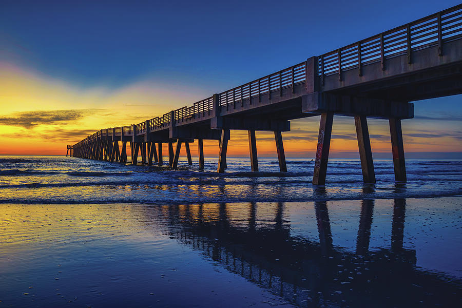 Golden Sunrise Reflection at the Jacksonville Beach Pier Photograph by Kim Seng