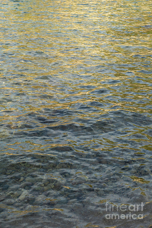 Golden Yellow Light Reflections In Clear Seawater Photograph