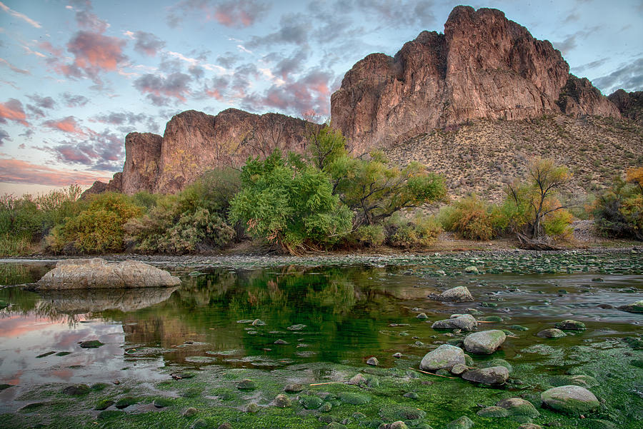 Goldfield Mountain Reflections in the rocky mossy Salt River Photograph by Dave Dilli
