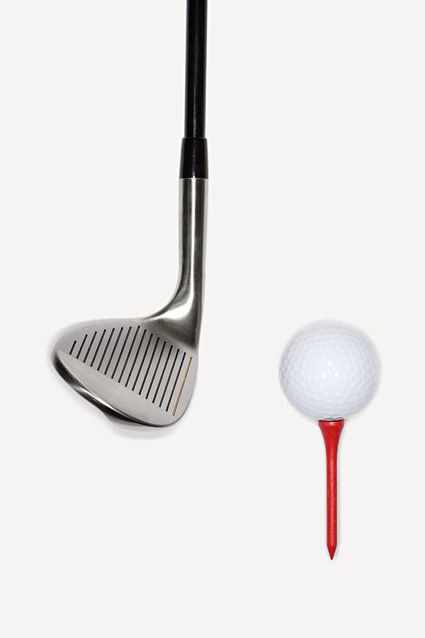Golf club with golf ball on a tee Photograph by Image Source