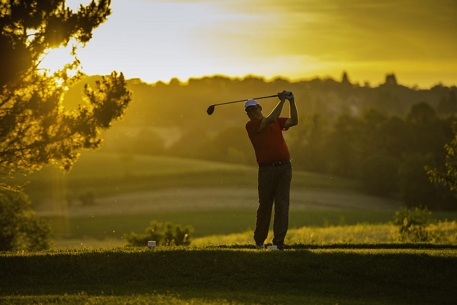 Golfer at Sunset Photograph by Vm
