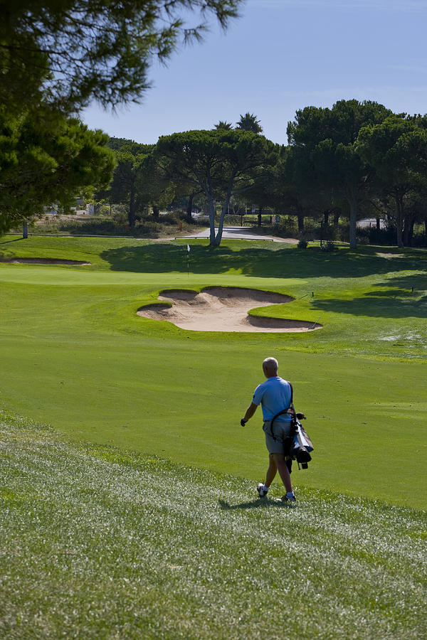 Golfer on a Portuguese golf course Photograph by Richard_Laurence