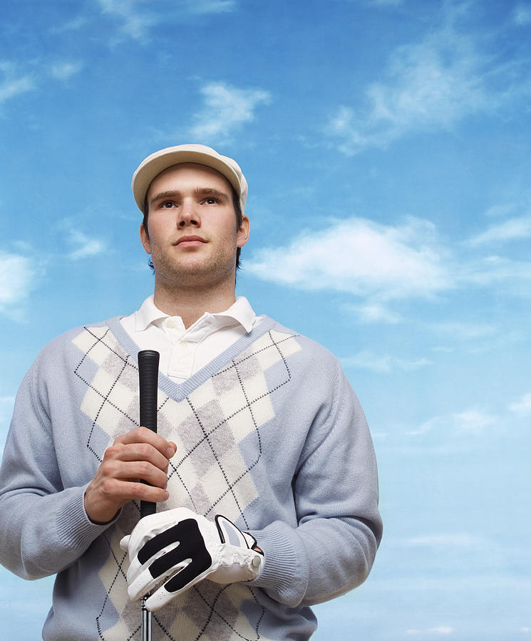 Golfer Wearing a Flat Cap and Holding a Golf Club Photograph by John Slater