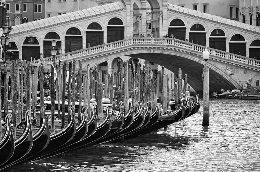 Gondola Bows Beneath Rialto Bridge in Venice Italy Black and White Photograph by Shawn OBrien
