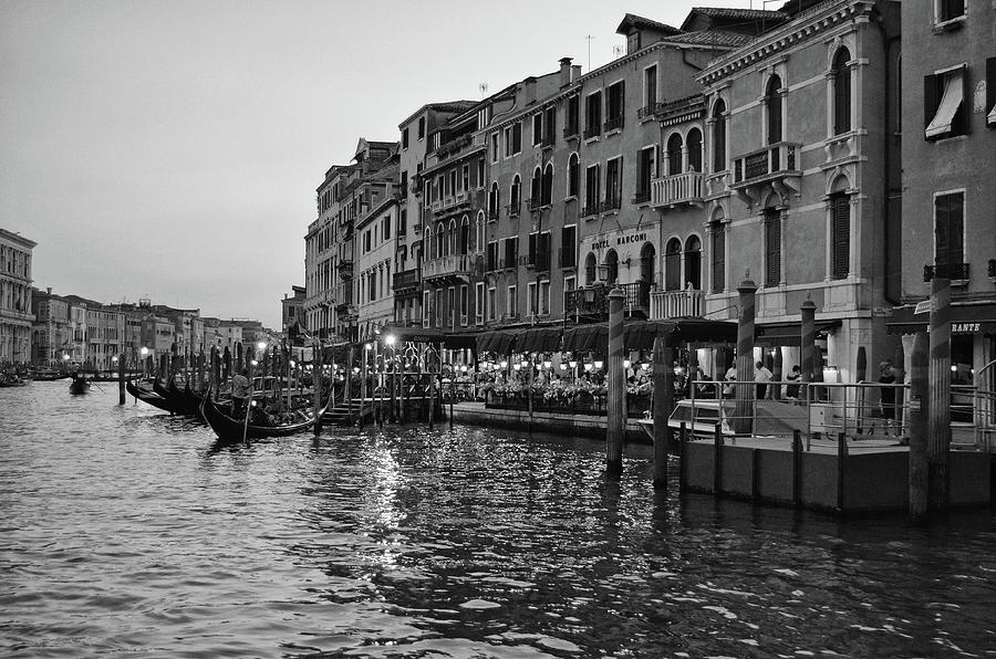 Gondolas Moored at an Evening Cafe Grand Canal Venice Italy Black and White Photograph by Shawn OBrien