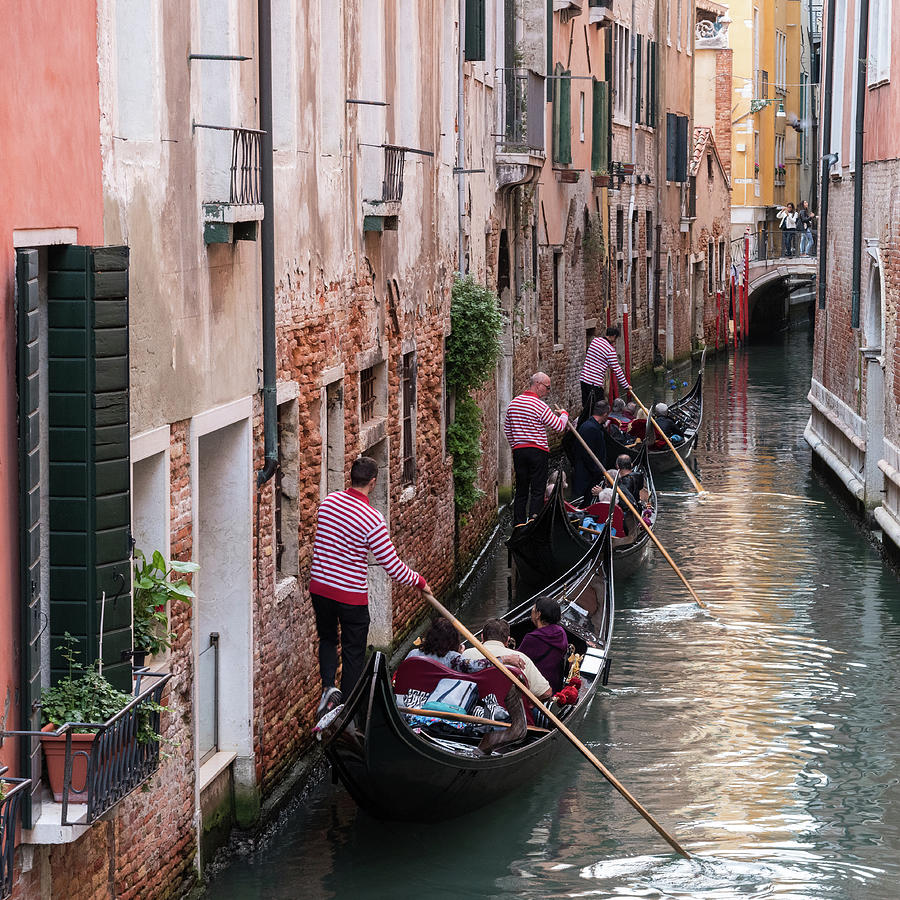 Gondoliers, Venice,Italy Photograph by Sarah Howard
