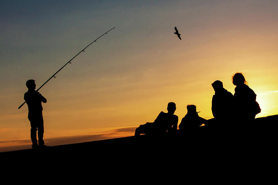 Fishing for the Sun - Howth, Dublin Photograph by John Soffe