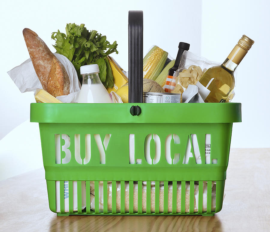 Goods in a shopping basket with buy local on it Photograph by David Malan