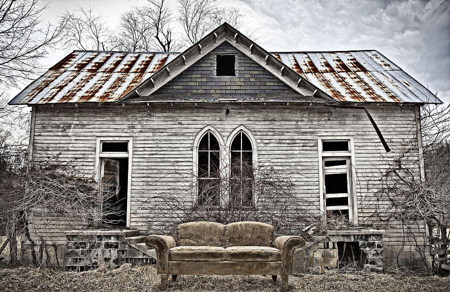 Gothic Building with Old Couch Photograph by Don Farrall