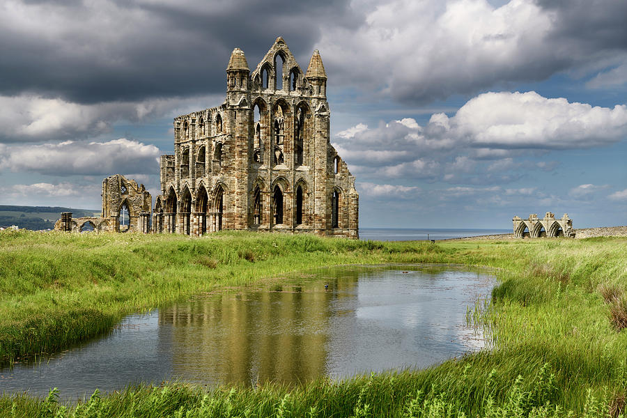 Gothic ruins of 13th Century Whitby Abbey church and Abbey House ...