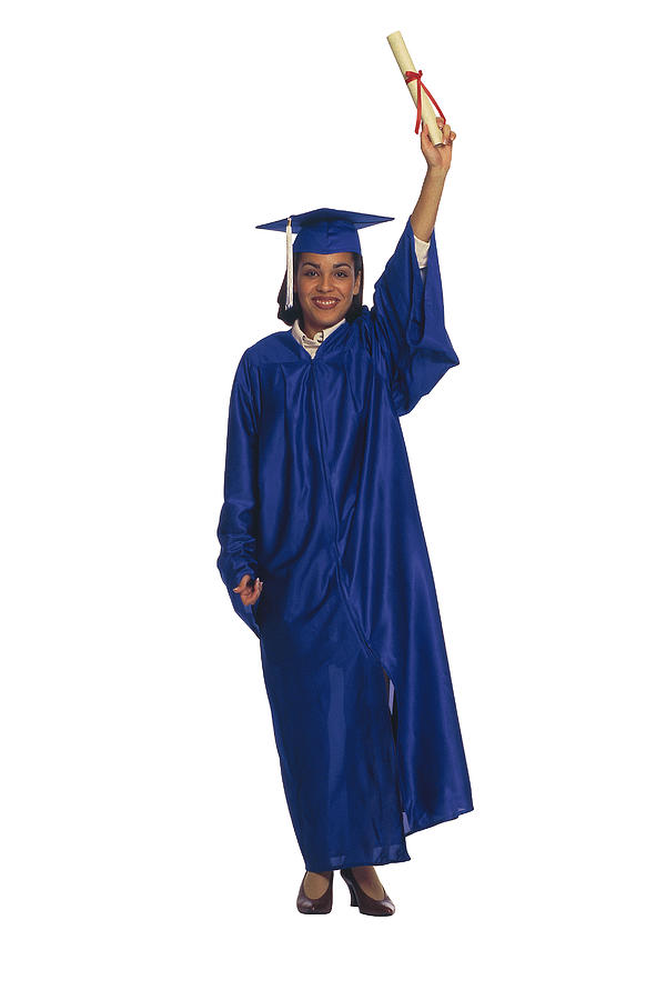 Graduate holding up diploma Photograph by Comstock