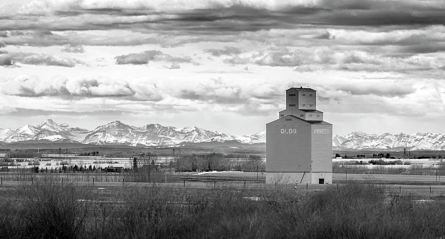 Mountain Photograph - Grain Elevator Against the Rockies by Phil And Karen Rispin