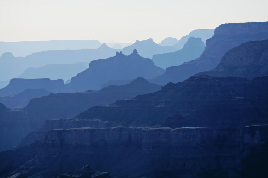 Grand Canyon blue silhouettes Photograph by Tatiana Travelways