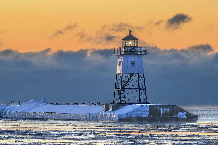 Grand Marais Lighthouse with Sea Smoke Photograph by Donald Tredinnick