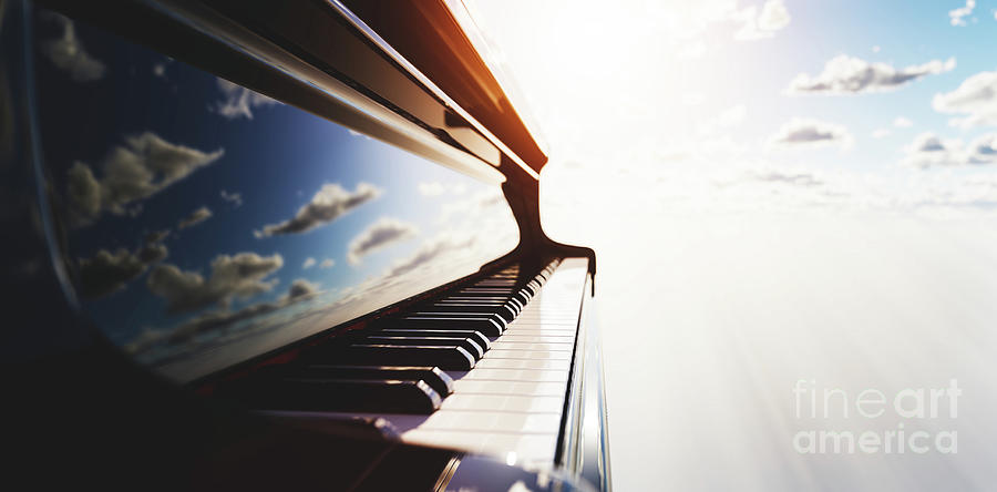 Grand piano keyboard on blue sky Photograph by Michal Bednarek