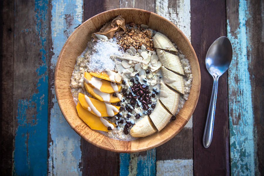 Granola fruit yogurt for breakfast Photograph by Zeljkosantrac