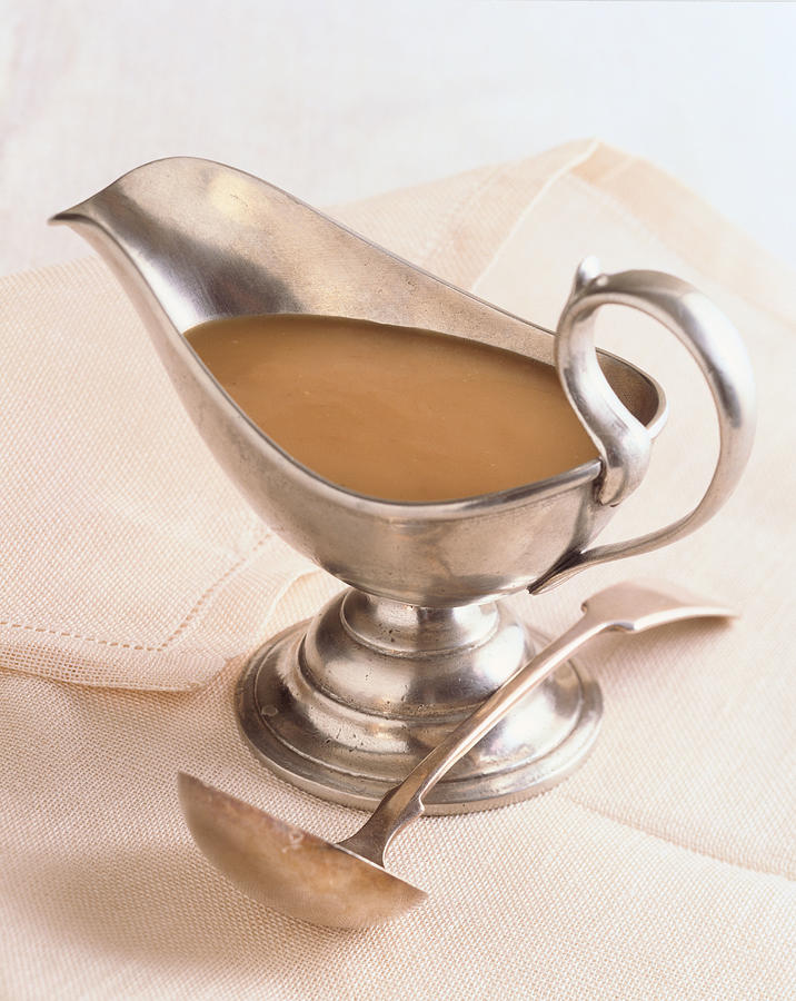 Gravy boat with ladle Photograph by Brian Hagiwara