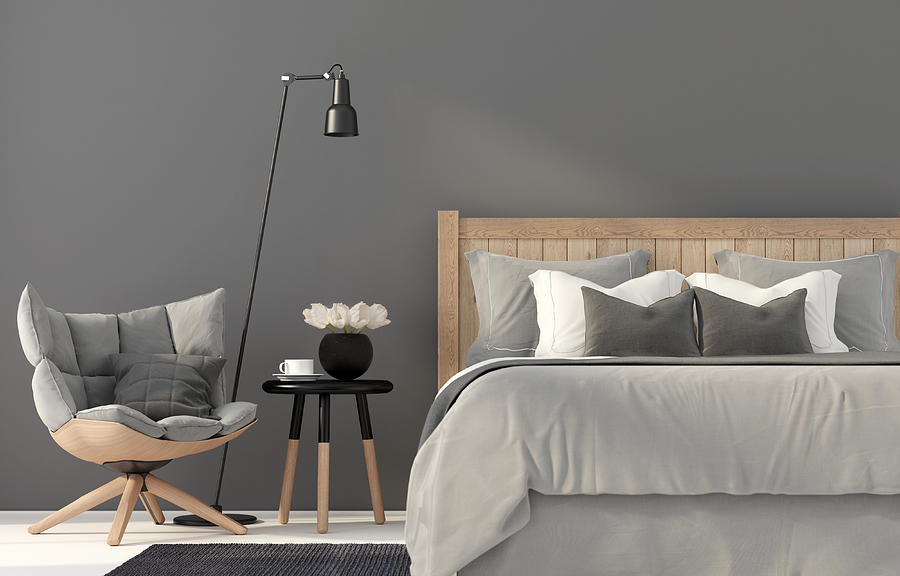 Gray bedroom with a wooden bed Photograph by JZhuk
