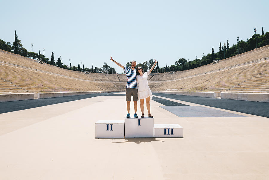 Greece, Athens, couple on the podium celebrating in the Panathenaic Stadium Photograph by Westend61