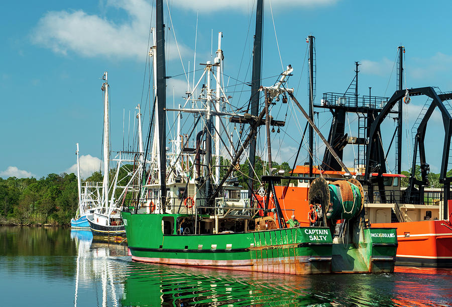 Green And Orange Colored Shrimp Boats Photograph