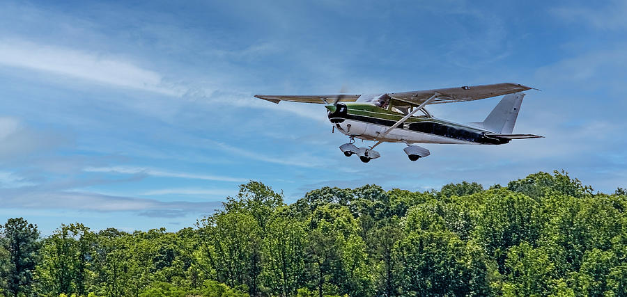 Green and White Plane in Flight Photograph by Darryl Brooks