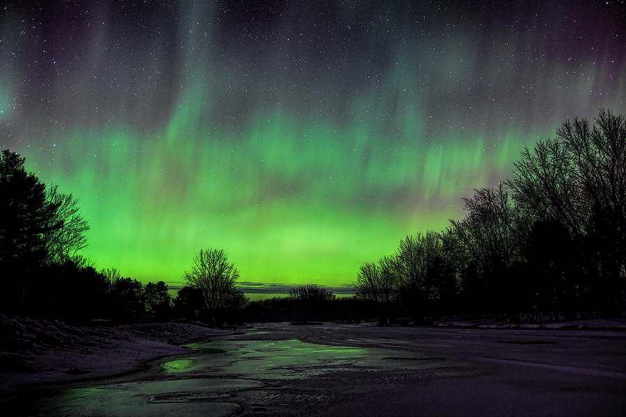 Green Aurora Over Frozen Eau Claire River Photograph by Dale Kauzlaric