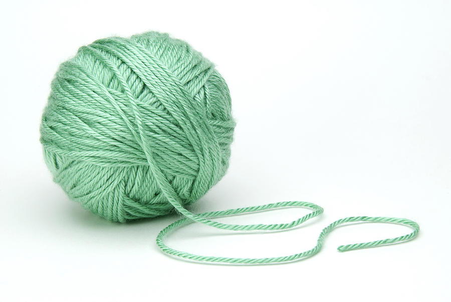 Green Ball Of Yarn On White Background Photograph by Arcimages