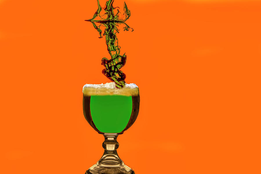 Green beer in a fishbowl with green cloud streaming into glass Photograph by Dan Friend Green beer in a fishbowl with green cloud streaming into glass Photograph by Dan Friend